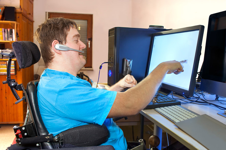 man with physical disability using internet 