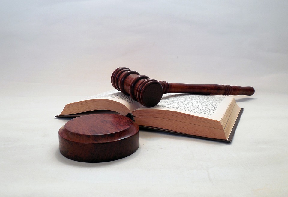 Gavel and book lying on a table